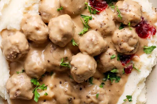 Close-up image of saucy swedish meatballs.