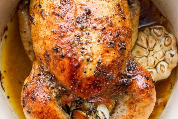 Whole roasted chicken in a dutch oven.