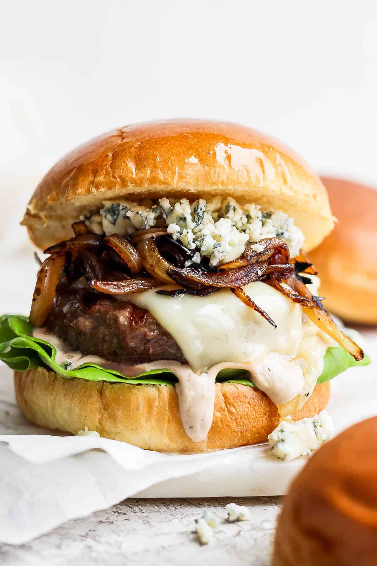 A bison burger with whiskey onions, gorgonzola cheese, and smokey sauce.