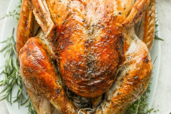 Top shot of a cooked Thanksgiving turkey on a platter.